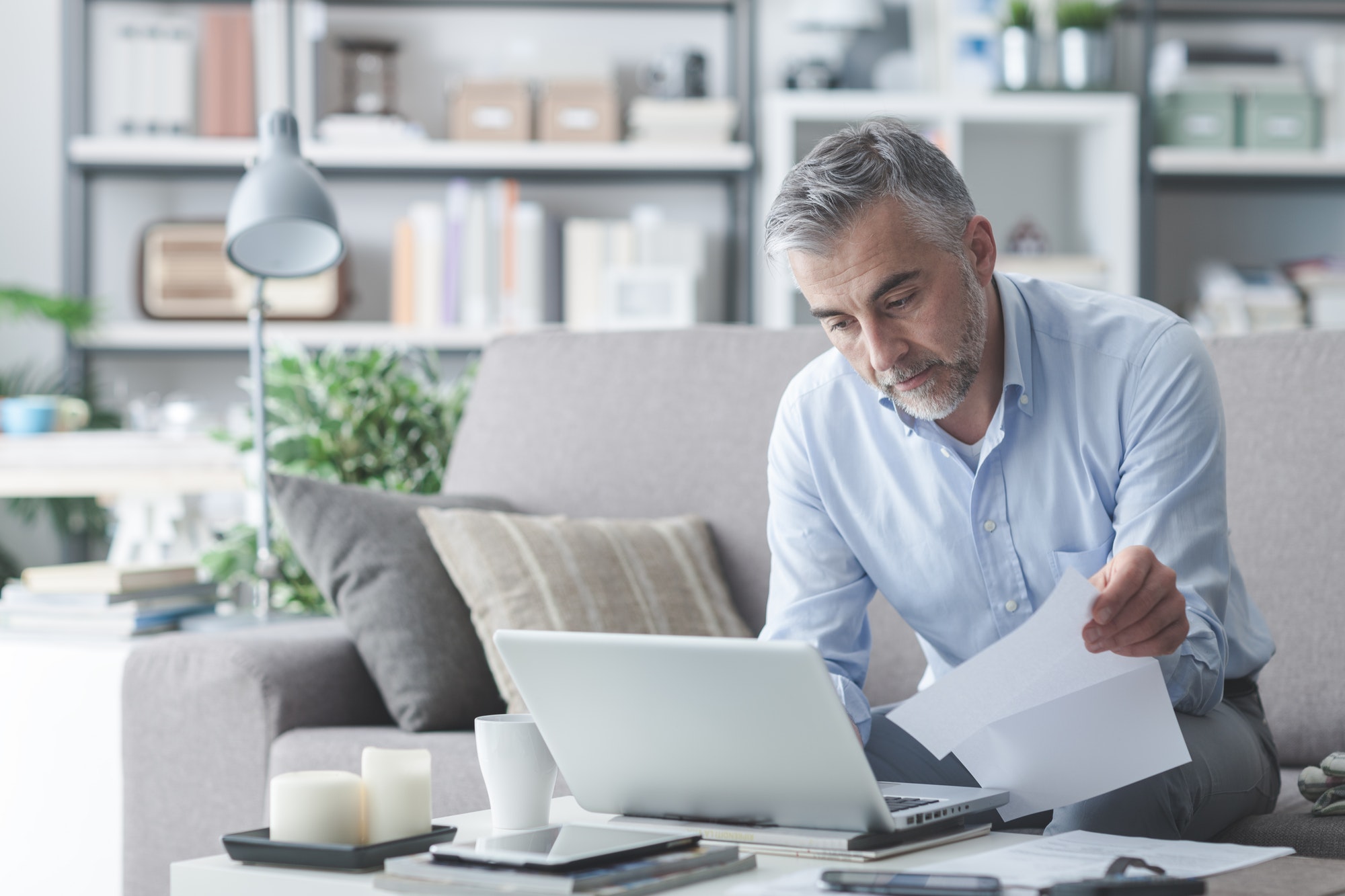 Businessman checking bills