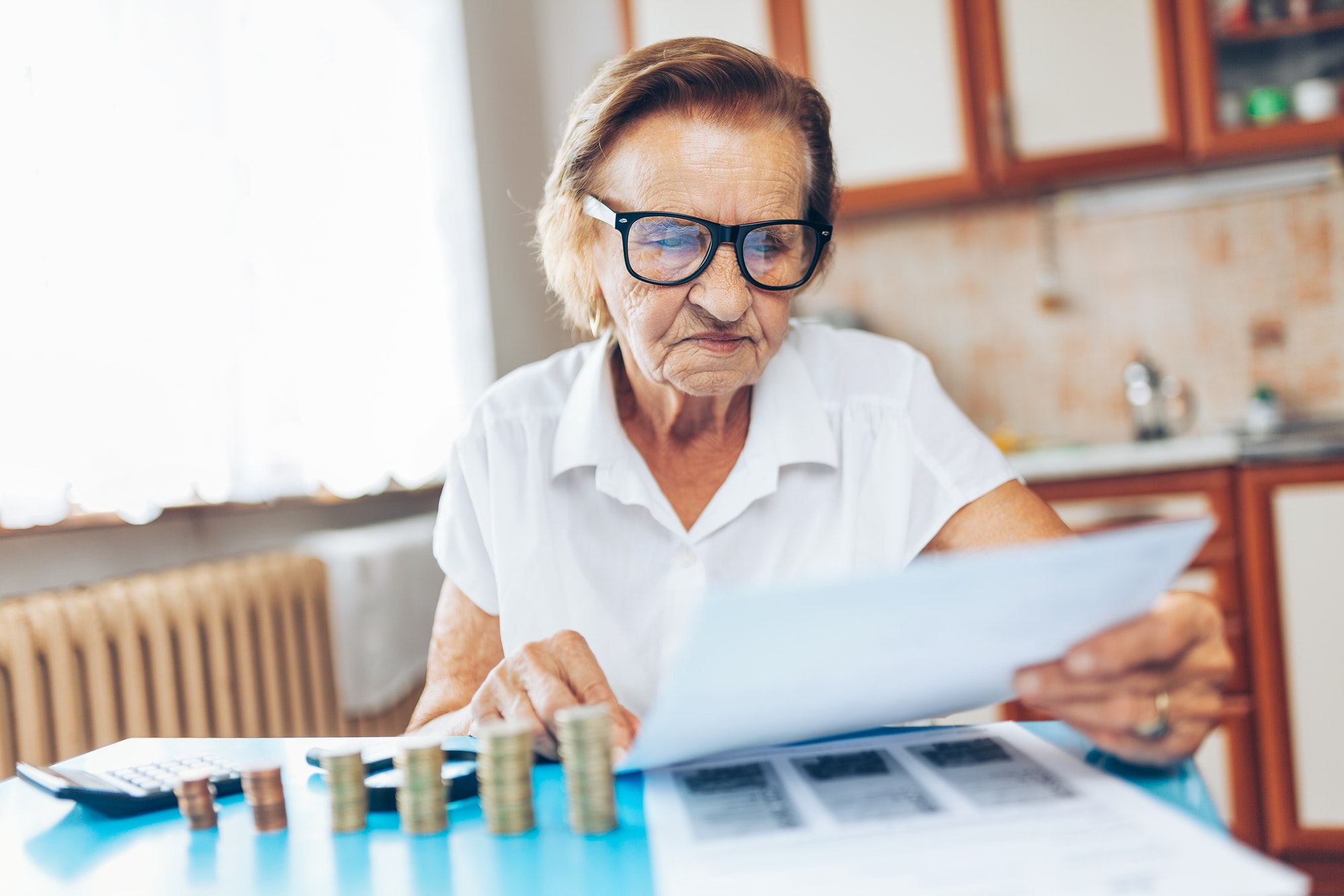 Senior woman checking her finances and investments